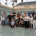 Tour group in the tiled main courtyard of Bahia Palace, Marrakech