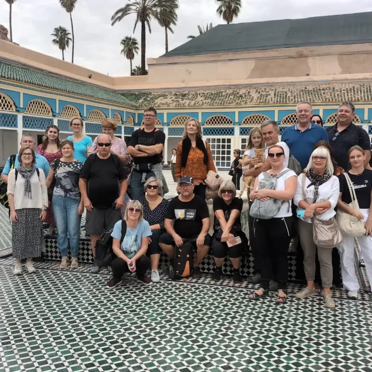 Tour group in the tiled main courtyard of Bahia Palace, Marrakech