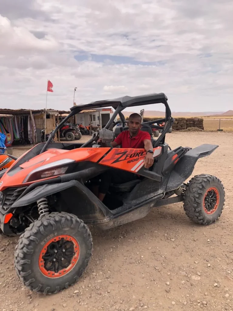 Driver at the wheel of an off-road buggy in the Agafay desert