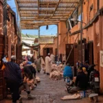 Covered souk passage with leather workers in Marrakech