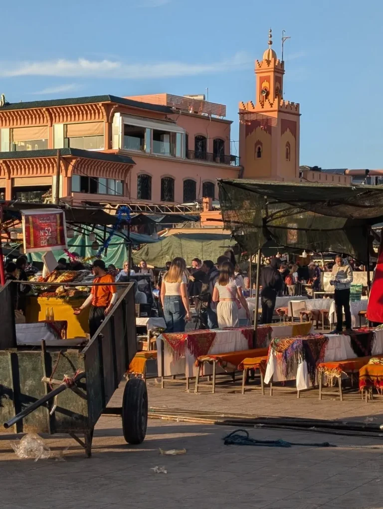 Food stalls being set up on Jemaa el-Fna square in the evening light