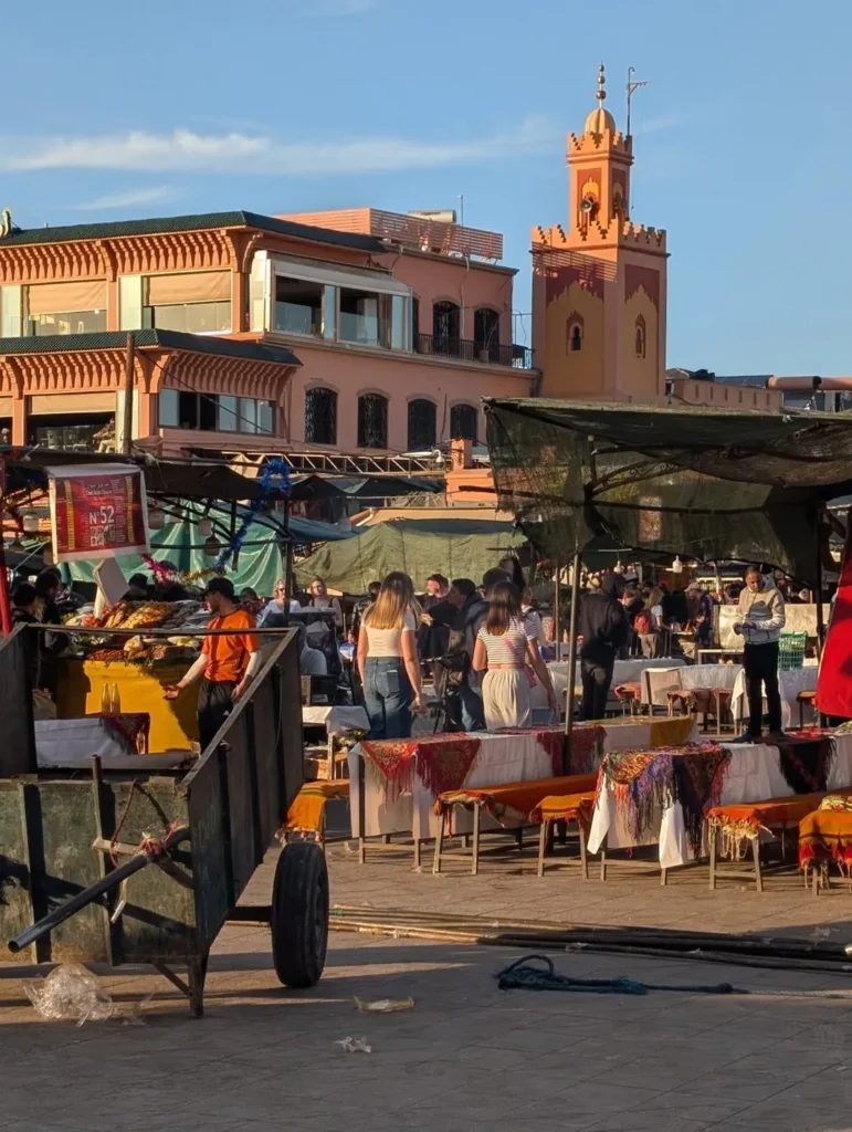 Food stalls being set up on Jemaa el-Fna square in the evening light