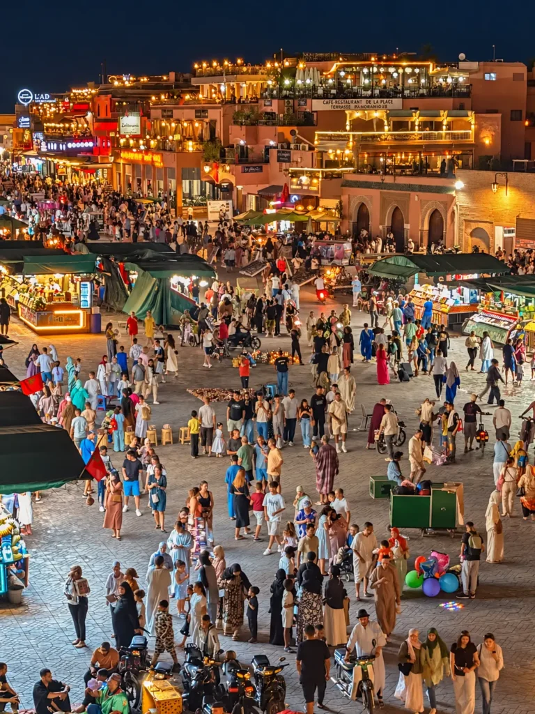 Crowds and lit food stalls on Jemaa el-Fna square at night