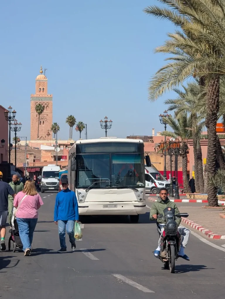 Street traffic in Marrakech with the Koutoubia minaret behind