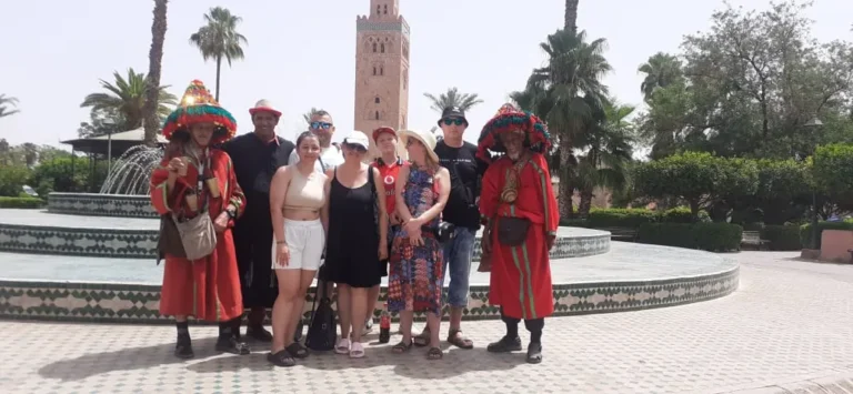 Visitors with traditional water sellers near the Koutoubia gardens